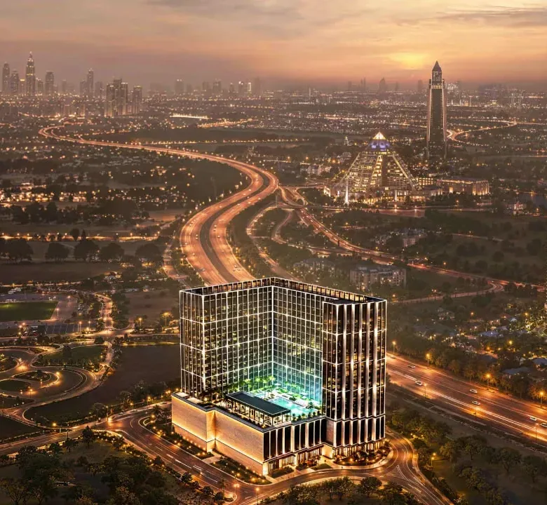 Aerial dusk view of Binghatti Starfall with pool terrace and Dubai skyline