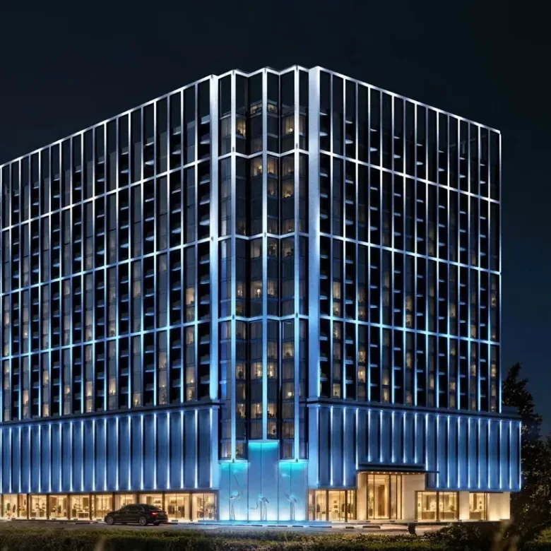 Binghatti Starfall night facade with illuminated entrance